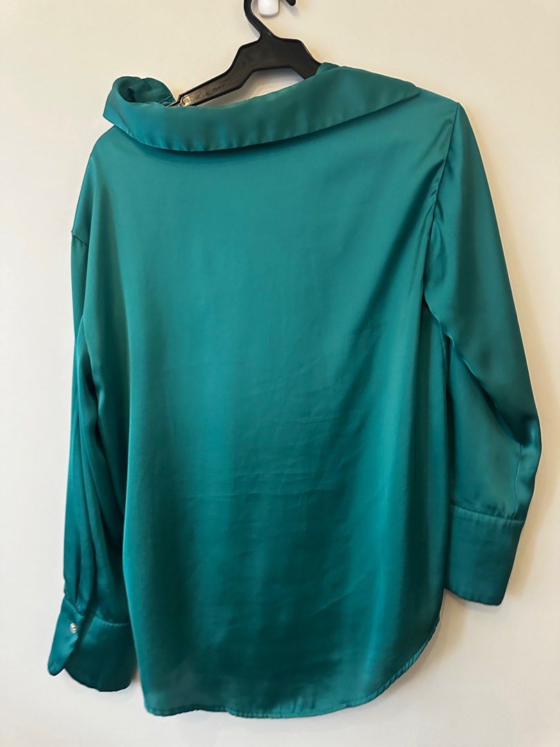 Zara Satin Blouse - Teal Green - Size S (Category: Blouses) located in Manila. Submitted by michelle1208 (Listing ID 1403042115, Image 2). Description: - Zara teal green satin blouse - Size: Small (S) - Features a flattering V-neck - Elegant long sleeves with cuff details - Single button closure - Made in Cambodia.