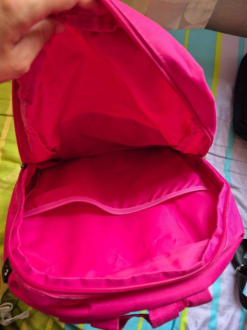 Backpack - Simple & Functional (Category: Backpacks) located in Singapore. Submitted by wickycloud (Listing ID 1407238523, Image 2). Description: - Vibrant pink backpack - Large main compartment - Front zippered pocket for easy access - Internal pocket for organization - Lightweight and easy to carry.