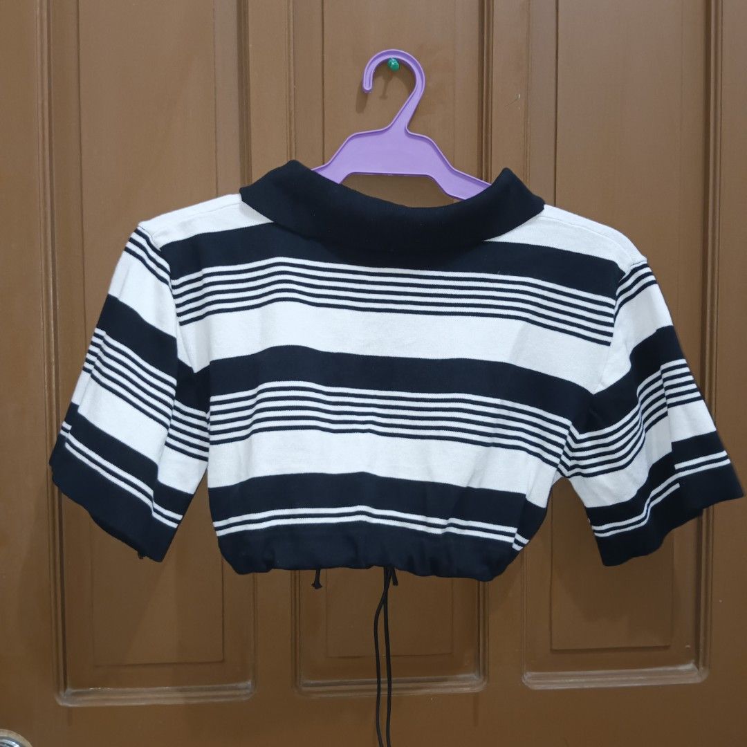 Black and White Striped Knitted Crop Top with Drawstring (Category: Others Tops) located in Caloocan City. Submitted by yoon_ara (Listing ID 1407240495, Image 2). Description: Black and white striped crop top with a collared neckline, short sleeves, and drawstring hem. Features a stylish lace-up front. Perfect for casual wear. Super cropped. Free size.Up to L.