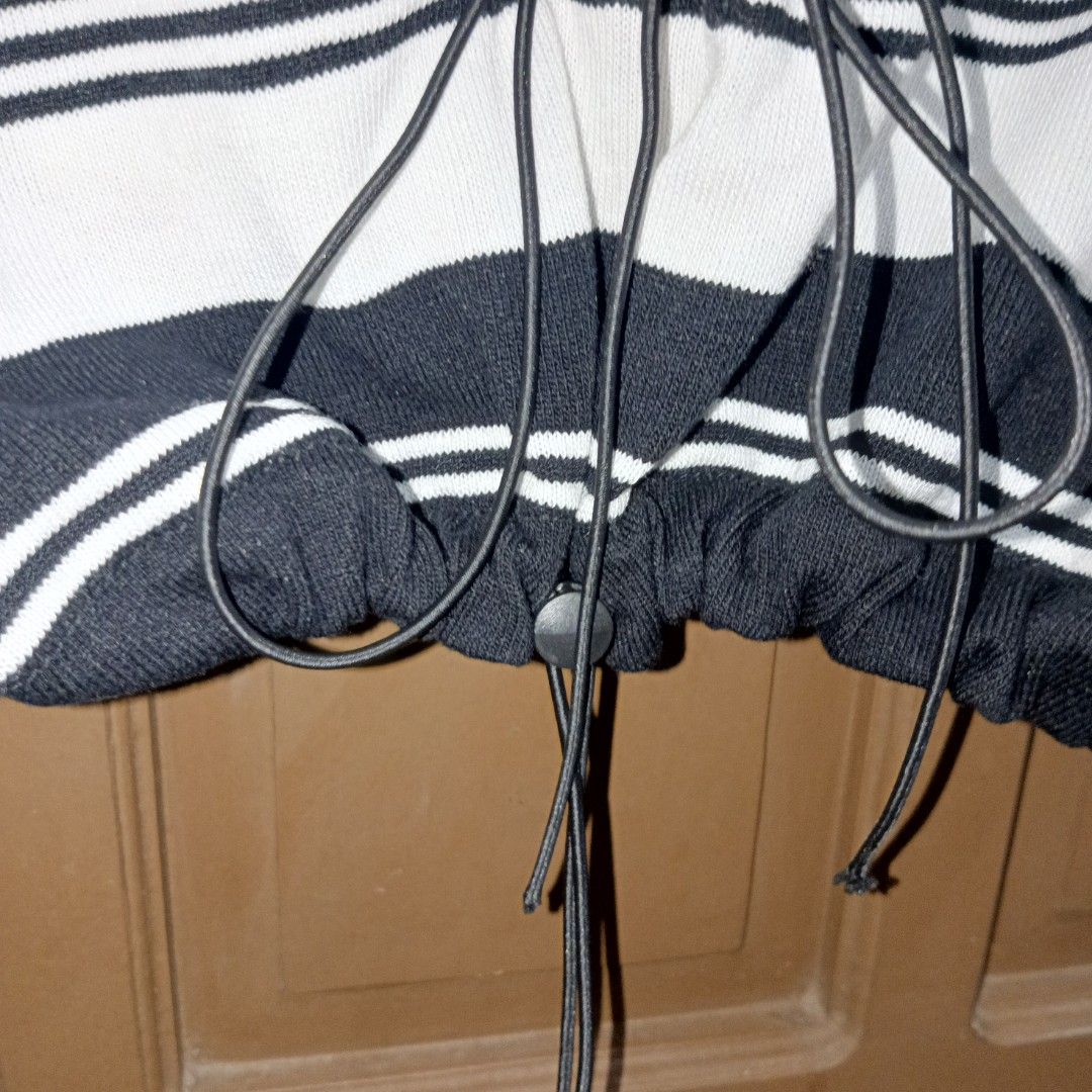 Black and White Striped Knitted Crop Top with Drawstring (Category: Others Tops) located in Caloocan City. Submitted by yoon_ara (Listing ID 1407240495, Image 3). Description: Black and white striped crop top with a collared neckline, short sleeves, and drawstring hem. Features a stylish lace-up front. Perfect for casual wear. Super cropped. Free size.Up to L.