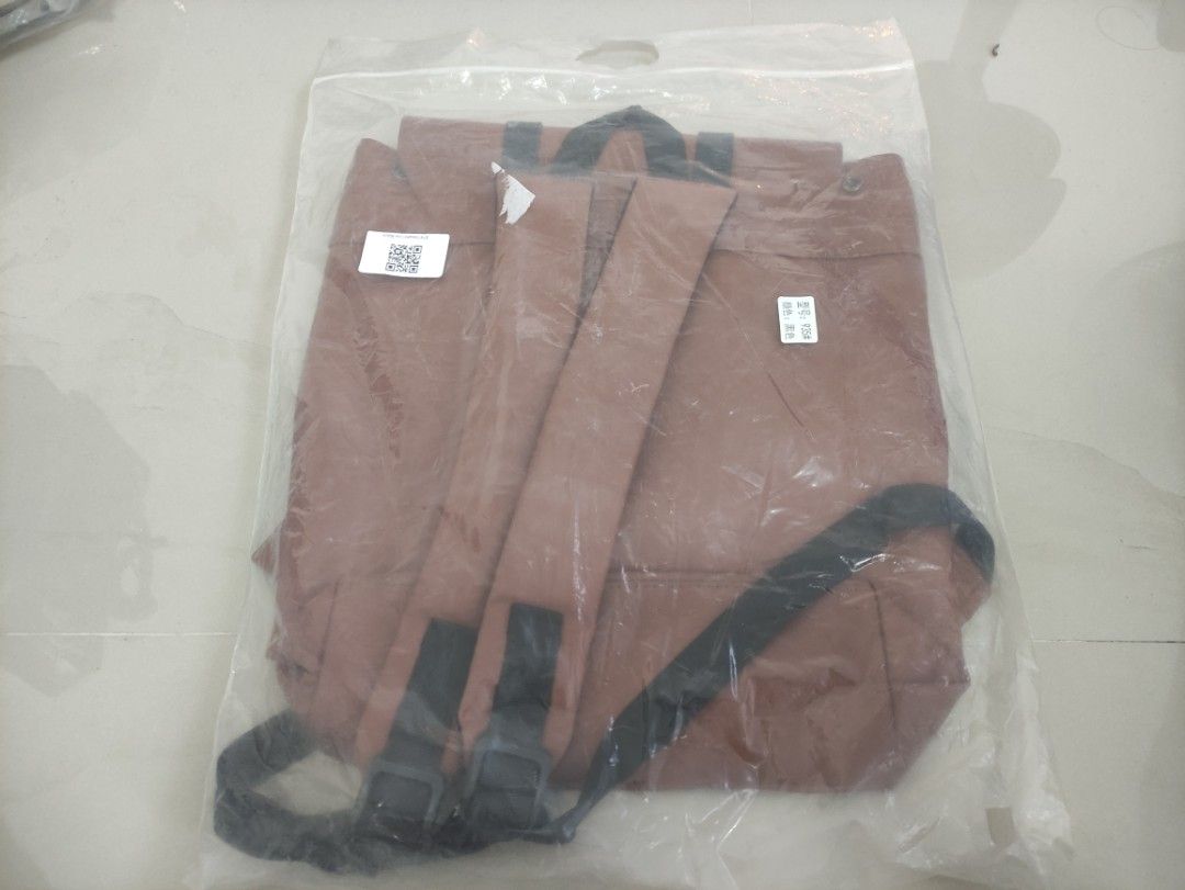 BRAND NEW Korean Brown Backpack with Black Straps (Category: Backpacks) located in Quezon City. Submitted by thetimelessfinds (Listing ID 1407200157, Image 2). Description: Selling my brand new leather backpack. Still in pristine condition. Purchased for office use, but I never got to use it as I was given an office backpack shortly after. In a very excellent, ready-to-use condition. This is a new and unused brown backpack, still sealed in its or