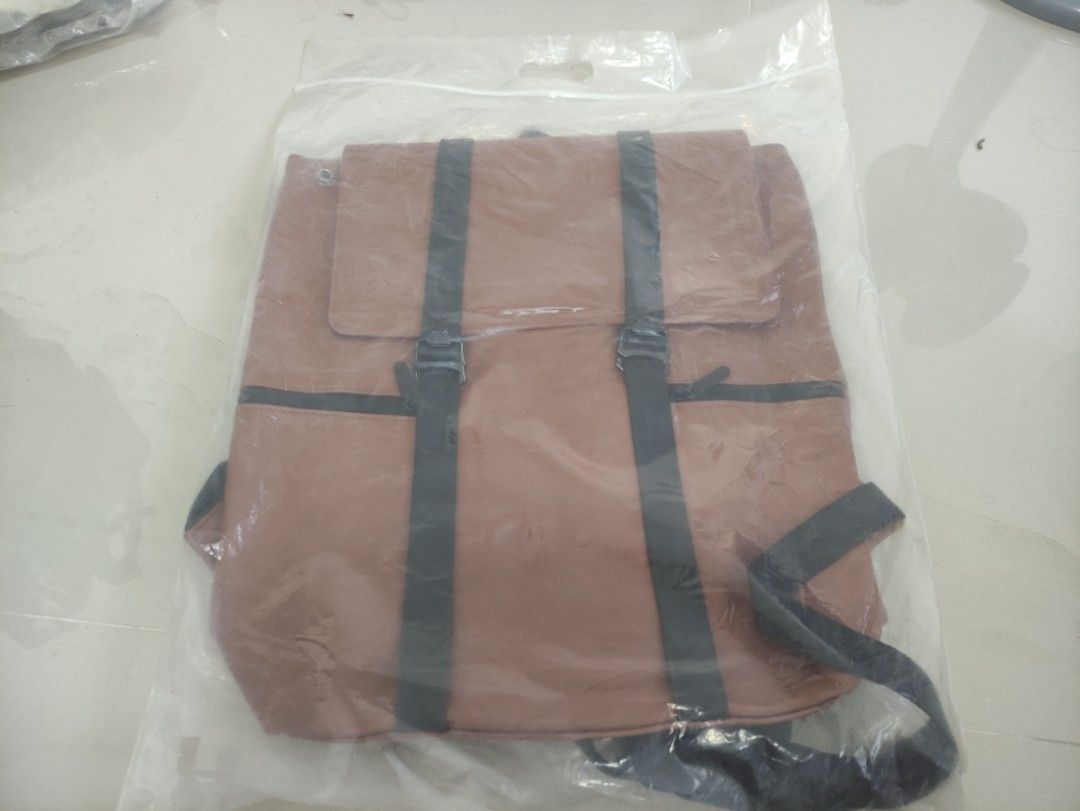 BRAND NEW Korean Brown Backpack with Black Straps (Category: Backpacks) located in Quezon City. Submitted by thetimelessfinds (Listing ID 1407200157, Image 1). Description: Selling my brand new leather backpack. Still in pristine condition. Purchased for office use, but I never got to use it as I was given an office backpack shortly after. In a very excellent, ready-to-use condition. This is a new and unused brown backpack, still sealed in its or