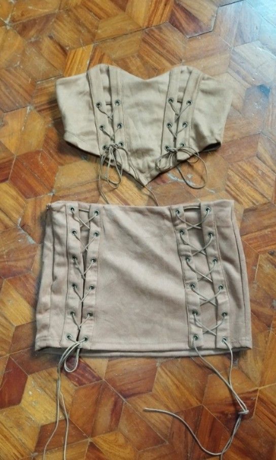 Brown Suede tube corset coordinates (Category: Sets or Coordinates) located in Manila. Submitted by jukatkatph (Listing ID 1407274342, Image 3). Description: Bust 28-36 Waist 30 Skirt length 11.5 Very pretty in actual. Suede fabric with inner lining -The photo posted are actual items which i edited the background since I have a messy room. In case of flaws and other stuffs, I will be 100% tranparent with it. - Accessories, petticoat or other stuf