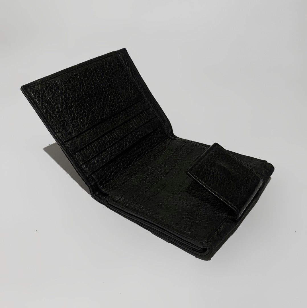 Bvlgari Black Wallet (Category: Luxury Bags & Wallets) located in Bacolod City. Submitted by bt_ph (Listing ID 1407279848, Image 3). Description: - Authentic Bvlgari wallet - Color: Black - Dimensions: 4.5 X 4 inches - Exterior: Textured with silver-tone accent - Interior: Red lining - Features: Multiple card slots and coin compartment - Closure: Snap - Visible Bvlgari logo.