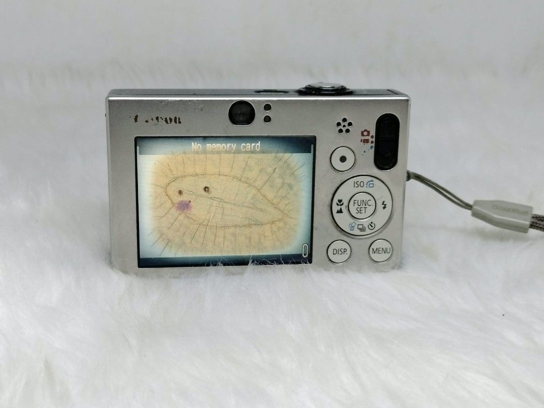 Canon IXY DIGITAL 10 Camera rare (Category: Cameras) located in Manila. Submitted by ultimogizmos (Listing ID 1407239376, Image 2). Description: - Canon IXY DIGITAL 10 digital camera - 7.1 Megapixels - Zoom lens - Silver color - Includes wrist strap - Screen displays 'No memory card' - Buttons: ISO, Function Set, Display, Menu issue burn lcd won't affect performance output.