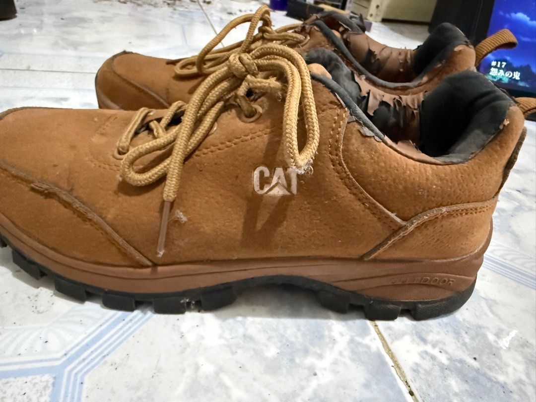 CAT Outdoor Shoes - Brown (Category: Sneakers) located in Manila. Submitted by alexiemari (Listing ID 1407205870, Image 2). Description: Brown CAT outdoor shoes. Features a lace-up design. The soles are marked with dirt. Size is indicated as UK 6.5, EUR 40, and CM 253. Made in Vietnam..