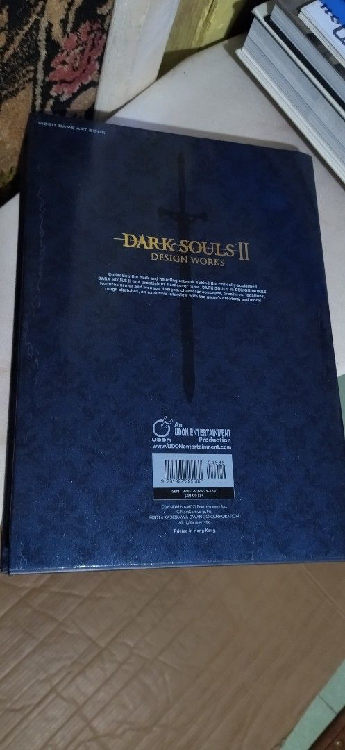 Dark Souls II Design Works Artbook (Category: Storybooks) located in Pateros City. Submitted by lancep2020 (Listing ID 1407200827, Image 2). Description: - Dark Souls II Design Works artbook. - Features concept art and character designs. - Dark blue cover with gold lettering. - Gold title on spine. 4 Sale Dark Souls 2 design works collectible HardBound book purchased in Japan New Condition No issues.