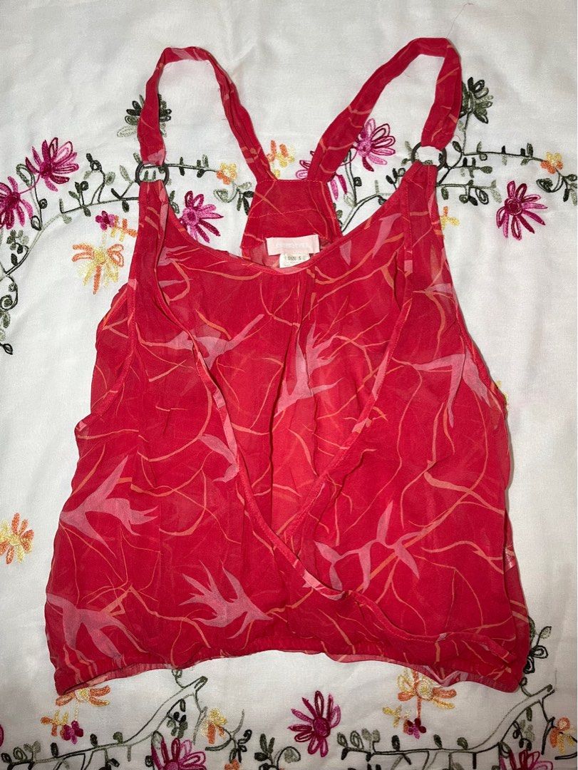 Diesel Red Tank Top Size S (Category: Sleeveless) located in Davao. Submitted by sonateine (Listing ID 1407276615, Image 1). Description: - Red Diesel tank top - Size: S - Halter neck with ring details - Wrap-style front - Elasticated hem - Unique pattern - Made in India - Embroidered back.