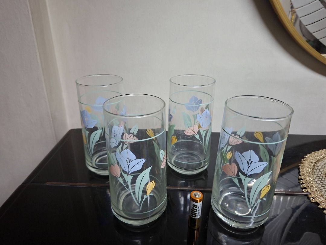 Floral Design Drinking Glasses Set (Category: Other Kitchenware & Tableware) located in Taguig. Submitted by d_man11 (Listing ID 1407202333, Image 2). Description: Vintage Drinking Glass set - Crisa Floral Tulip Galss Tumbler pattern - Vintage item, part of the Corelle Livingware line - No chips, no cracks - 4 pieces Dimensions 15 x 6.6 cm.