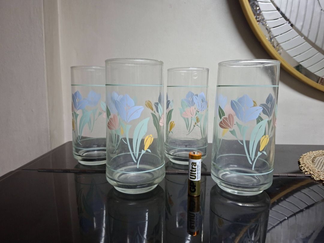 Floral Design Drinking Glasses Set (Category: Other Kitchenware & Tableware) located in Taguig. Submitted by d_man11 (Listing ID 1407202333, Image 1). Description: Vintage Drinking Glass set - Crisa Floral Tulip Galss Tumbler pattern - Vintage item, part of the Corelle Livingware line - No chips, no cracks - 4 pieces Dimensions 15 x 6.6 cm.