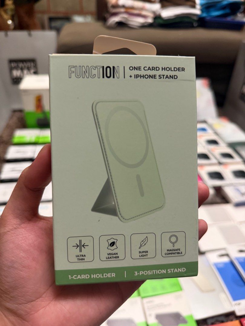 Function One Card Holder + Iphone Stand (Category: Mounts & Holders) located in Quezon City. Submitted by law.1789 (Listing ID 1407290961, Image 1). Description: Function One Card Holder + Iphone Stand - 650 (1290 SRP) - Ultra-thin and super-light design - Made with vegan leather - Functions as a 1-card holder and iPhone stand - MagSafe compatible - Features a super strong magnetic connection - Includes an easy-access internal card slot - Offers 