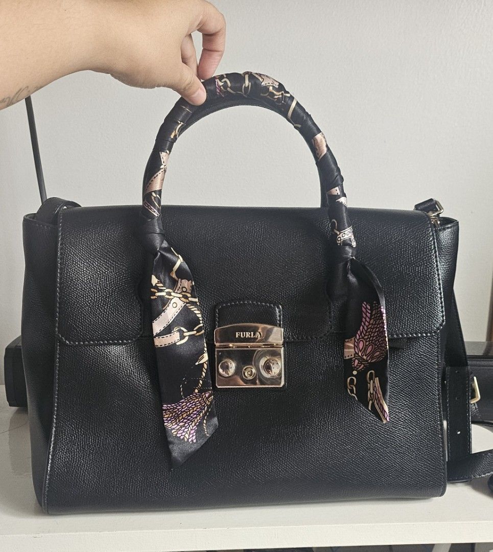 Furla Metropolis Satchel (Category: Luxury Bags & Wallets) located in San Juan City. Submitted by mjdeclutters (Listing ID 1407258360, Image 1). Description: Furla Metropolis Satchel - Top handle and detachable shoulder strap - Includes key and twilly (due to leather handle problems) - Authentic - Personal preloved - flaws due to storage see 5th and 6th pics.