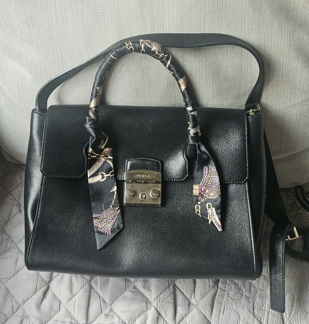 Furla Metropolis Satchel (Category: Luxury Bags & Wallets) located in San Juan City. Submitted by mjdeclutters (Listing ID 1407258360, Image 2). Description: Furla Metropolis Satchel - Top handle and detachable shoulder strap - Includes key and twilly (due to leather handle problems) - Authentic - Personal preloved - flaws due to storage see 5th and 6th pics.