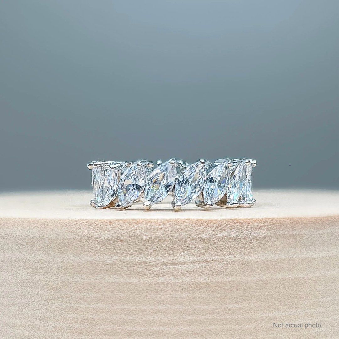 Garnet ring (Category: Rings) located in Manila. Submitted by jmacg (Listing ID 1407278458, Image 1). Description: Eternity ring marquise stone shape. Stone size: 5 mm. Ring size: ~size 6. Comes with a box. Material: Cubic zirconia on rhodium plated brass. Has discoloration.