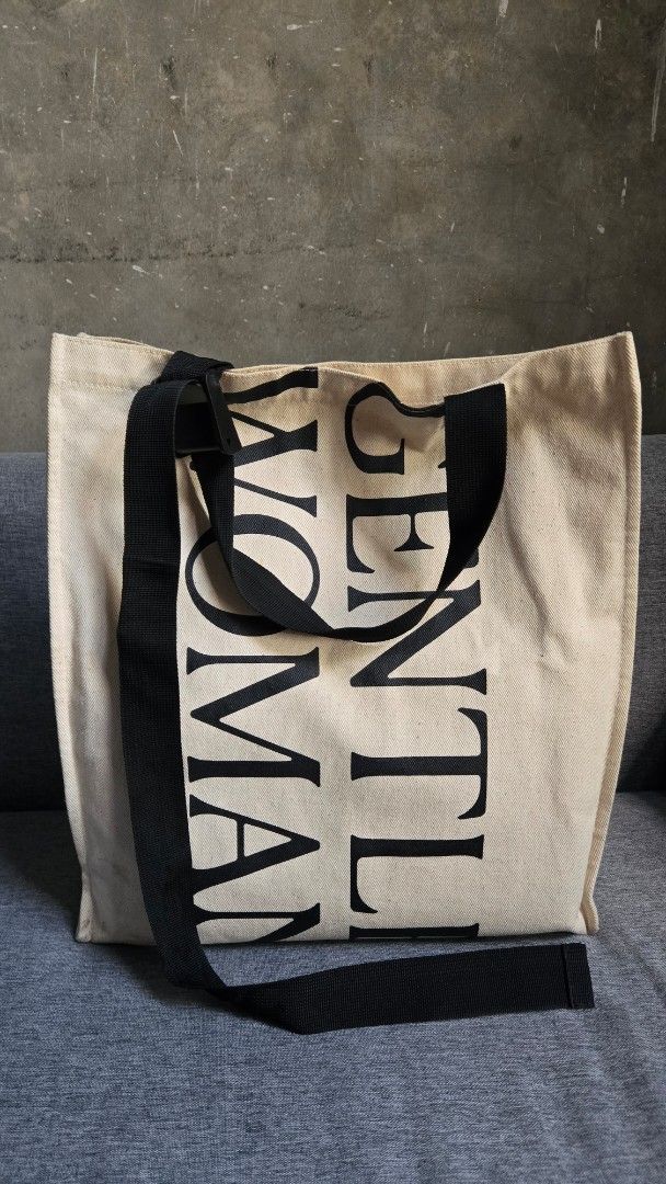 Gentlewoman Tote Bag (Category: Tote Bags) located in Meycauayan. Submitted by tuschy (Listing ID 1407260066, Image 1). Description: - Gentlewoman tote bag - Black adjustable strap - Magnetic closure - Beige exterior with black brand print - Light beige interior - Minor stains present PRELOVED, GINAMIT KO PO SYA KAYA MAY MGA DUMI. PWEDE LABHAN. PWEDENG AKO NA DIN ANG MAGLABA MUNA 😄😄😄 BOUGHT IN THAILAND DI KO NA GINAGAMIT.