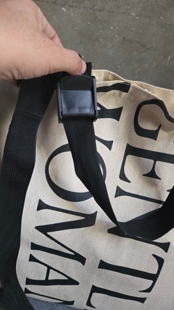 Gentlewoman Tote Bag (Category: Tote Bags) located in Meycauayan. Submitted by tuschy (Listing ID 1407260066, Image 2). Description: - Gentlewoman tote bag - Black adjustable strap - Magnetic closure - Beige exterior with black brand print - Light beige interior - Minor stains present PRELOVED, GINAMIT KO PO SYA KAYA MAY MGA DUMI. PWEDE LABHAN. PWEDENG AKO NA DIN ANG MAGLABA MUNA 😄😄😄 BOUGHT IN THAILAND DI KO NA GINAGAMIT.
