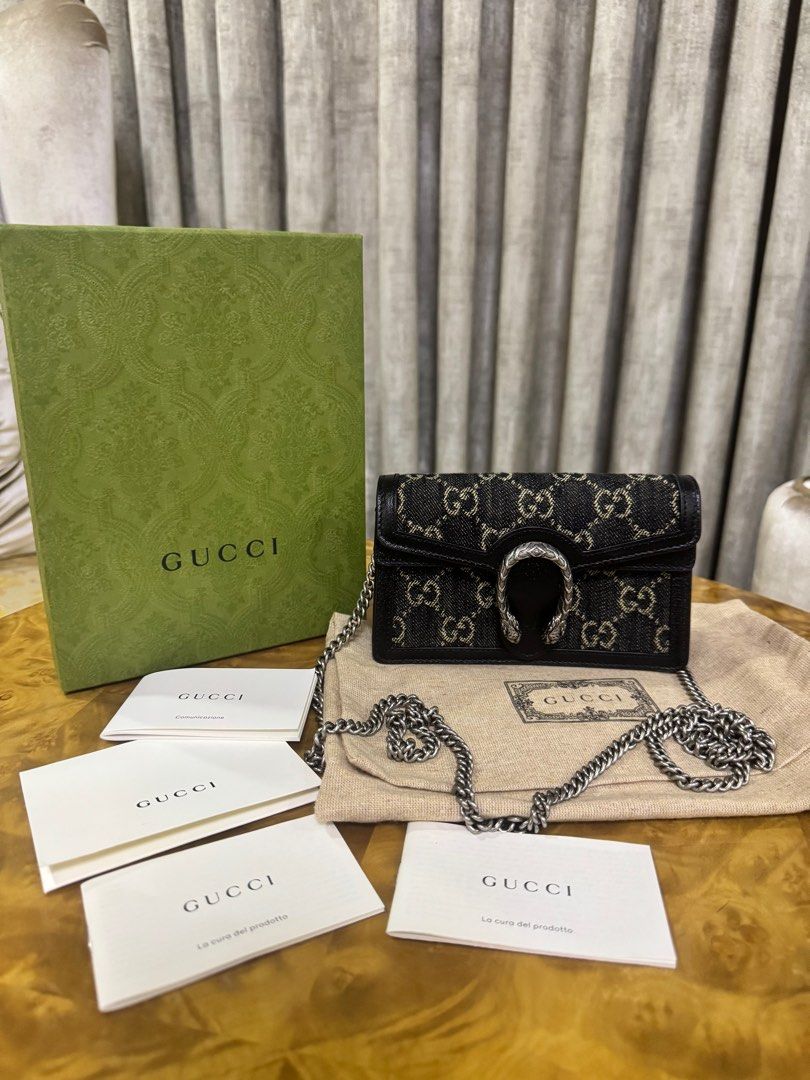 Gucci Dionysus Black Mini Bag GG Denim Authentic (Category: Luxury Bags & Wallets) located in Makati City. Submitted by happyprelovedph (Listing ID 1407195780, Image 1). Description: - Authentic Gucci Dionysus Super Mini Bag - Black leather trim - Chain strap - Includes original box, dust bag, and authenticity cards - Iconic Gucci GG pattern - Black leather interior with Gucci logo - Silver-tone hardware -Almost New.