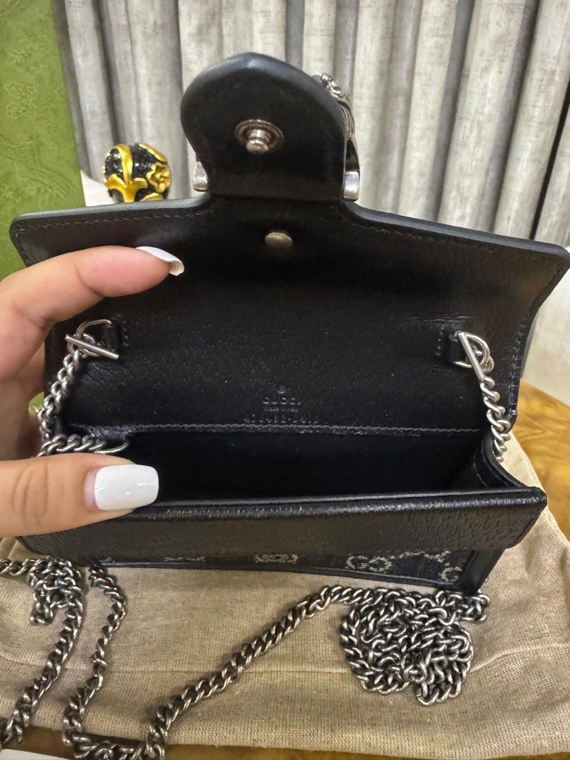 Gucci Dionysus Black Mini Bag GG Denim Authentic (Category: Luxury Bags & Wallets) located in Makati City. Submitted by happyprelovedph (Listing ID 1407195780, Image 2). Description: - Authentic Gucci Dionysus Super Mini Bag - Black leather trim - Chain strap - Includes original box, dust bag, and authenticity cards - Iconic Gucci GG pattern - Black leather interior with Gucci logo - Silver-tone hardware -Almost New.