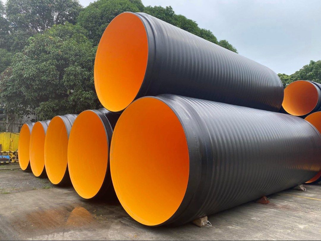 HDPE Pipes (Category: Construction & Building Materials) located in Makati City. Submitted by redesetgo (Listing ID 1407250734, Image 1). Description: Made in the Philippines Large Diameter HDPE PIPES, FITTINGS, MANHOLE & FLANGE. Ranging from DN/ID 400mm to 3000mm diameter. - New corrugated pipes - Black exterior, orange interior - Suitable for construction and industrial applications - Unused condition - Large size for significant flow DM for mo