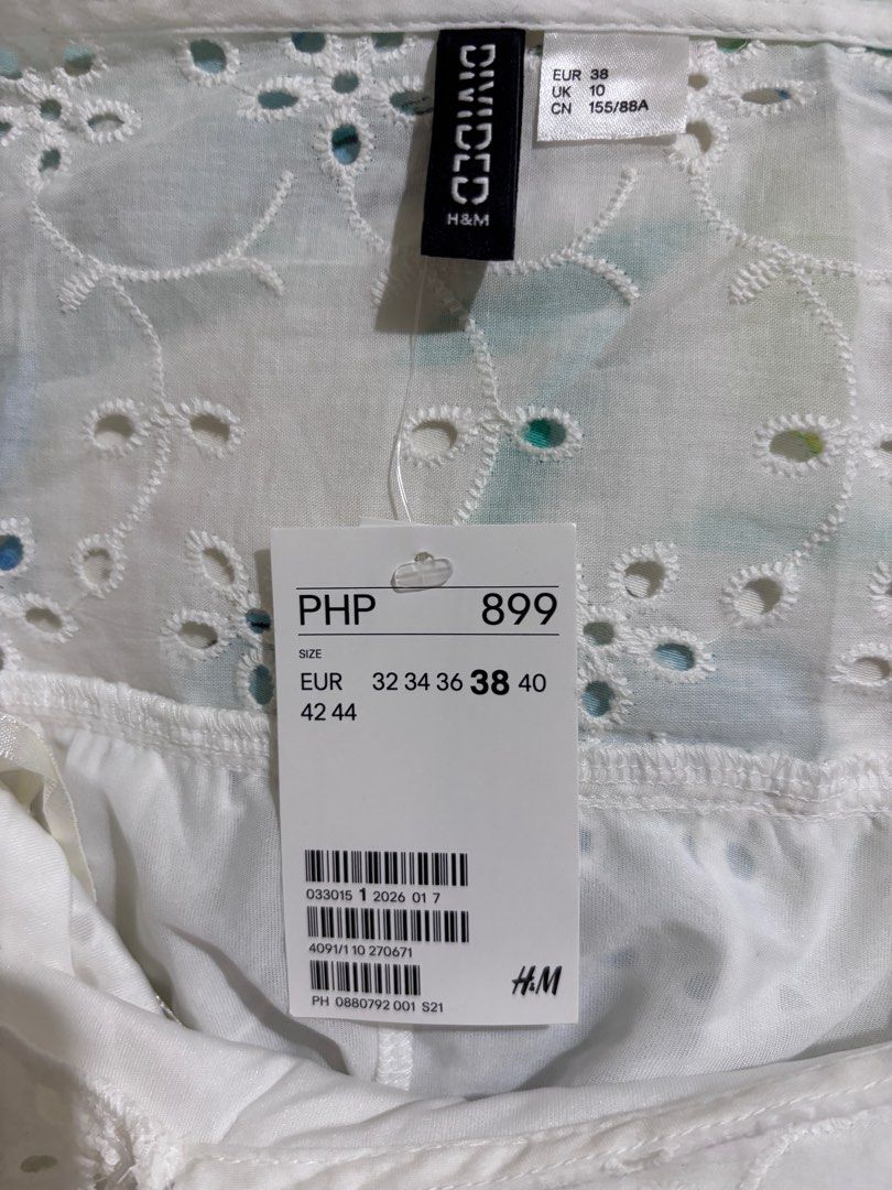 H&M White Embroidered Dress (Category: Dresses) located in Taguig. Submitted by chic_fleuriste (Listing ID 1407254304, Image 3). Description: - H&M white embroidered dress - Features a square neckline - Puff sleeves - Tiered design - Floral embroidery - Size: EUR 38 / UK 10.