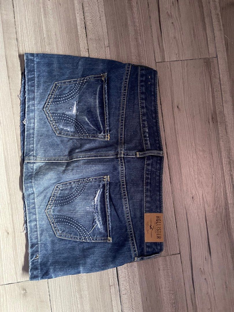 Hollister Mini Denim Skirt (Category: Skirts) located in Daraga. Submitted by oniomaniaa (Listing ID 1407230768, Image 2). Description: - Hollister denim skirt - Size 7, waist 28 - Distressed design - Button and zipper closure - Front and back pockets - Hollister logo detail - Versatile for casual outfits.