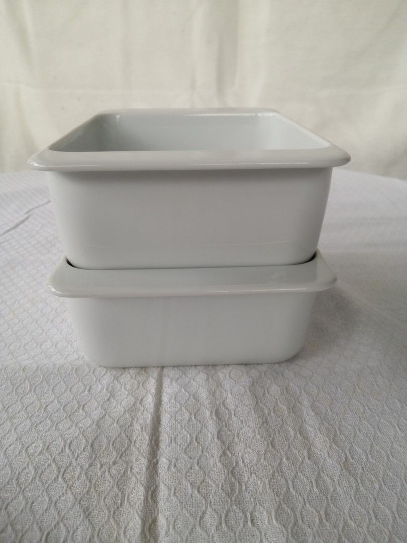 IKEA Square Baking Dishes (Category: Bakeware) located in Liloan. Submitted by aidolcapz88 (Listing ID 1407287836, Image 2). Description: - Set of two IKEA square baking dishes - White ceramic material - Modern and simple design - Slightly raised edges - Ideal for baking or serving small portions - Features IKEA logo and product information on the bottom.