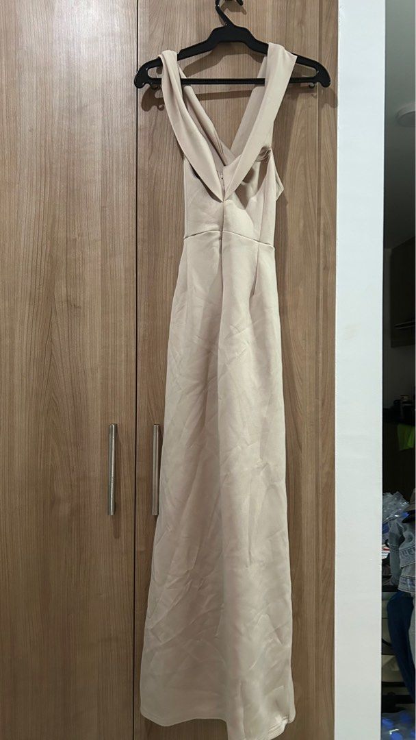 ISHTA Beige Maxi Neoprene - XL (Category: Dresses) located in Pasig City. Submitted by eenamagg (Listing ID 1407285115, Image 2). Description: - ISHTA beige maxi dress - Size: XL - Features a unique cross-back design - Zipper closure - Floor-length - Ideal for special occasions and formal events.