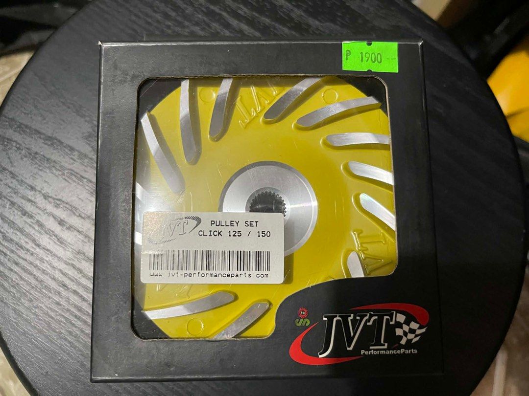JVT Pulley Set for Click 125/150 (Category: Announcements) located in Manila. Submitted by csg86 (Listing ID 1407353810, Image 2). Description: - JVT Performance Parts pulley set. - Fits Click 125/150. - Includes yellow pulley and other components. - Brand new, in original packaging. - Price: ₱1900. - Designed for improved performance..
