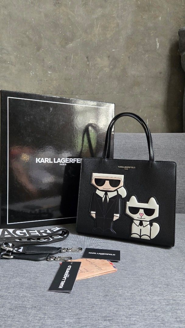 Karl Lagerfeld Black Tote Bag (Category: Tote Bags) located in Meycauayan. Submitted by tuschy (Listing ID 1407195239, Image 2). Description: - Black Karl Lagerfeld tote bag - Unique design - Top handle and detachable shoulder strap - Secure zip closure - Includes original box and tags - Features Karl Lagerfeld logo - Interior pocket - slightly used - with sign of usage. has minimal scratches -negotiable.