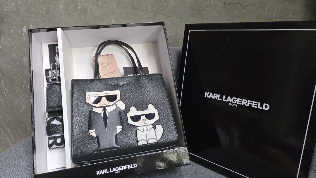 Karl Lagerfeld Black Tote Bag (Category: Tote Bags) located in Meycauayan. Submitted by tuschy (Listing ID 1407195239, Image 1). Description: - Black Karl Lagerfeld tote bag - Unique design - Top handle and detachable shoulder strap - Secure zip closure - Includes original box and tags - Features Karl Lagerfeld logo - Interior pocket - slightly used - with sign of usage. has minimal scratches -negotiable.