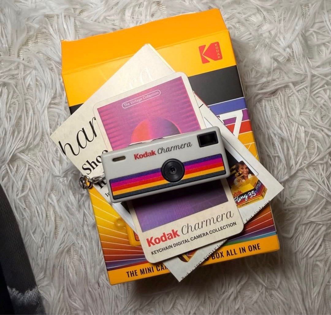 Kodak Charmera Keychain Digital Camera (Category: Cameras) located in Makati City. Submitted by CameraHubPH (Listing ID 1407257616, Image 3). Description: 🎀 Kodak Charmera 🎀 (Opened only to check, still brand new!) 💖 Features: • Ultra–mini size — fits in your palm or hangs on your bag for that aesthetic charm • Retro-inspired rainbow stripe design (soooo 70s coquette core 🌈) • Keychain-style body — bring it everywhere effortlessly 💗 Conditio
