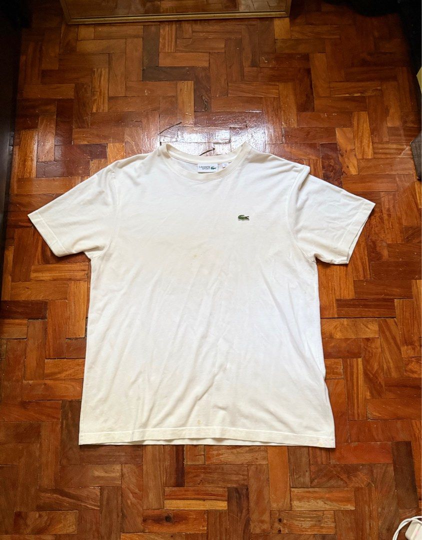 Lacoste white shirt (Category: Tshirts & Polo Shirts ) located in Quezon City. Submitted by reidify (Listing ID 1407199562, Image 1). Description: Size L original removable stains.