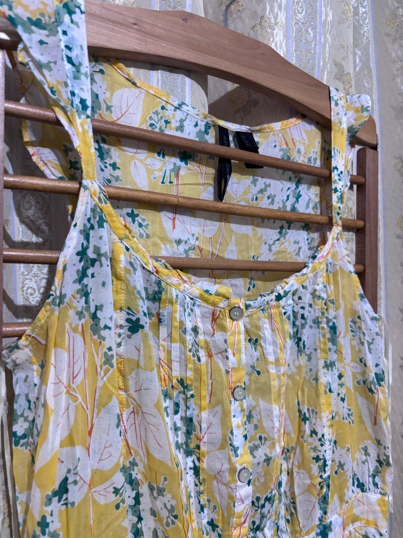 Mango Casual Floral Dress (Category: Dresses) located in Taguig. Submitted by chic_fleuriste (Listing ID 1407254638, Image 2). Description: - Mango yellow floral dress - Size M - Scoop neckline - Button-down front - Gathered waist - Made from cotton and viscose blend - Relaxed fit - Perfect for warm weather.