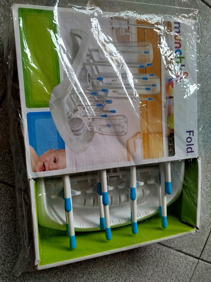 Munchkin Fold Drying Rack (Category: Breastfeeding & Bottle Feeding) located in San Pedro. Submitted by ey_shoppe (Listing ID 1407202586, Image 2). Description: - Munchkin Fold Drying Rack - Holds baby bottles and accessories - Foldable for easy storage and portability - Features multiple pegs for various items - New and unused - Still in original packaging.