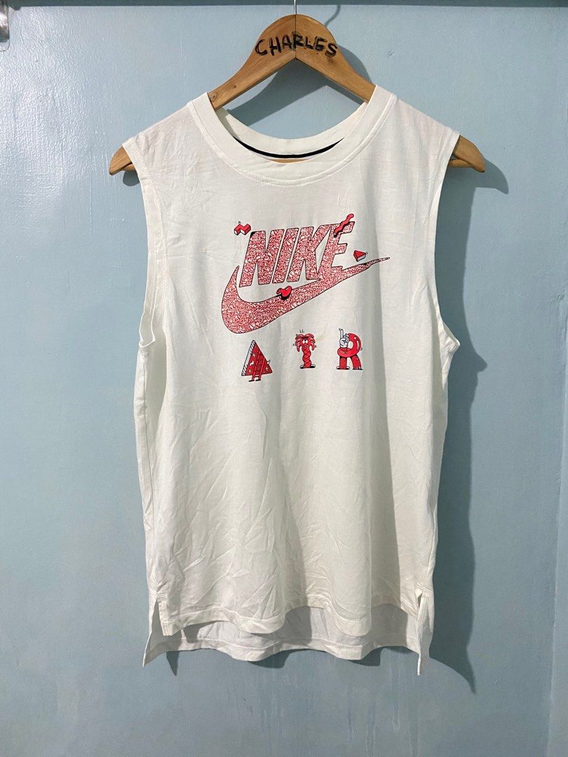 Nike Air Graphic Tank Top - White (Category: Sleeveless) located in Cabanatuan. Submitted by chingweyyy (Listing ID 1407306520, Image 1). Description: - White Nike tank top - Unique graphic design - Features Nike logo and "AIR" in playful font - Sleeveless with round neckline - Size: M - Made in China - Style: SU161203NIG - Code: 728468-100.