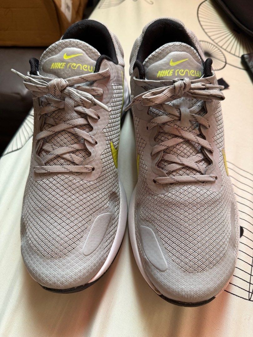 Nike Renew Ride 3 Running Shoes (Category: Sneakers) located in Manila. Submitted by gm002 (Listing ID 1407212788, Image 2). Description: - Nike Renew Ride 3 - Color: Gray with yellow swoosh - Size: US 9.5, EUR 43, CM 27.5 - Features: Mesh upper, white sole, black interior and laces - Condition: Soles show wear - Model: DC8185-003.