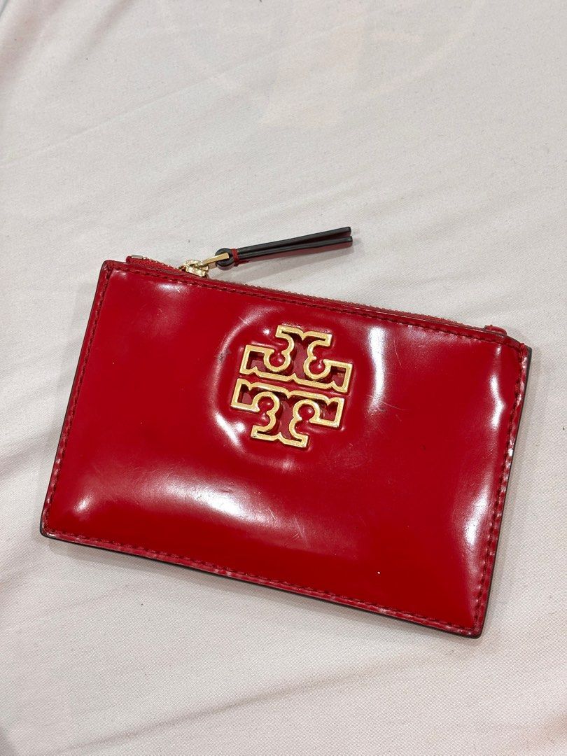 Original Tory Burch Britten Zip Card Case Red (Category: Wallets & Card holders) located in Digos. Submitted by rara031 (Listing ID 1407287341, Image 1). Description: Original Tory Burch Britten Zip Card Case in a Red Patent leather Bought this for 3,800 Very good condition See flaws in last pic 📍davao del sur.