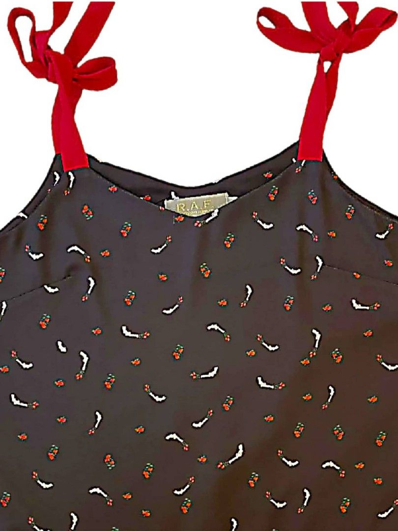 Plains and Prints/ R.A.F. (Category: Blouses) located in Manila. Submitted by prettypink4 (Listing ID 1407072282, Image 1). Description: - Unique print with red and white accents - Dark background - Red tie straps - V-neck design - Size 02 - Comfortable and stylish.