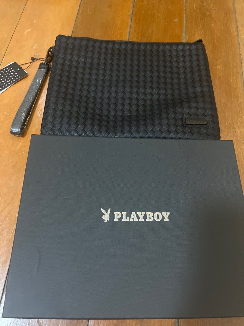 Playboy Woven leather Clutch Bag (Category: Belt bags, Clutches and Pouches) located in Malabon City. Submitted by ann1ere (Listing ID 1407322647, Image 3). Description: - Playboy black clutch bag - Woven exterior design - Features a wrist strap - Secure zipper closure - Interior pocket with Playboy logo - Includes original box and tags - 12.5 x 9.75 inches.