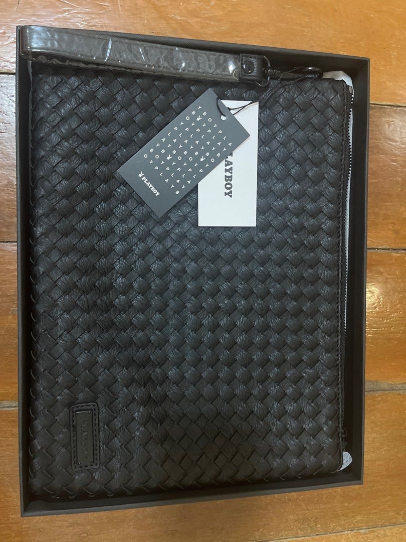 Playboy Woven leather Clutch Bag (Category: Belt bags, Clutches and Pouches) located in Malabon City. Submitted by ann1ere (Listing ID 1407322647, Image 1). Description: - Playboy black clutch bag - Woven exterior design - Features a wrist strap - Secure zipper closure - Interior pocket with Playboy logo - Includes original box and tags - 12.5 x 9.75 inches.