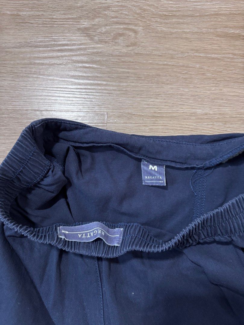Regatta Navy Blue Skorts - Size M (Category: Shorts) located in Calamba. Submitted by happymom02 (Listing ID 1407220404, Image 3). Description: - Regatta navy blue skort - Size: M - Features an elastic waistband - Wrap-around design - Perfect for casual wear - Comfortable and stylish.