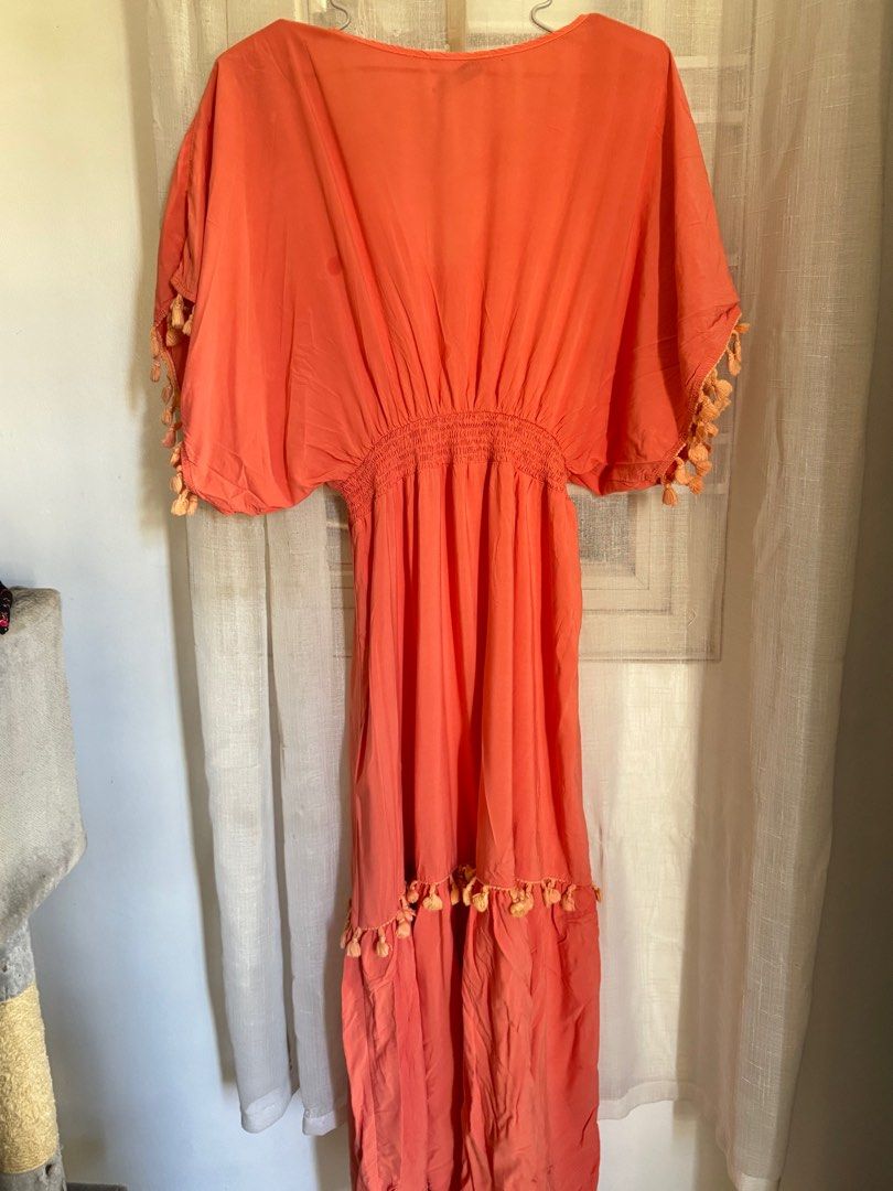 Rusttydustty Coral Maxi Dress (Category: Dresses) located in Angeles City. Submitted by mityi10s (Listing ID 1407341330, Image 3). Description: - Rusttydustty coral maxi dress - Size: M - Features: - V-neckline - Elasticated waist - Short sleeves with tassel detailing - Tiered skirt with tassel accents Letting go for 349, negotiable.