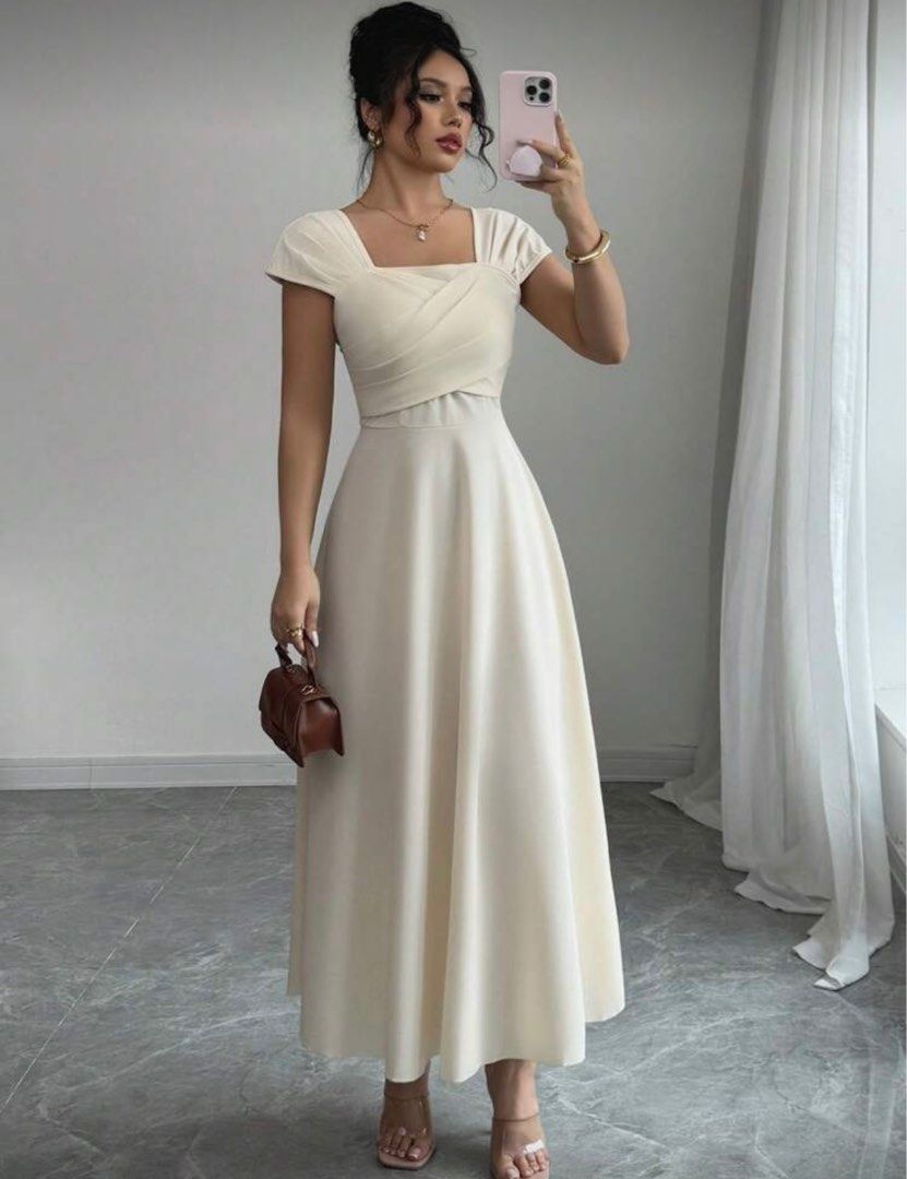 Shein Cream Midi Dress (Category: Dresses) located in Cavite. Submitted by cielinesid (Listing ID 1407313057, Image 1). Description: - Shein cream midi dress - Size: XL - Features: Crossover bodice, flowing skirt - Measurements: 39" bust, 33.9" waist - Condition: Never worn - Perfect for special occasions .