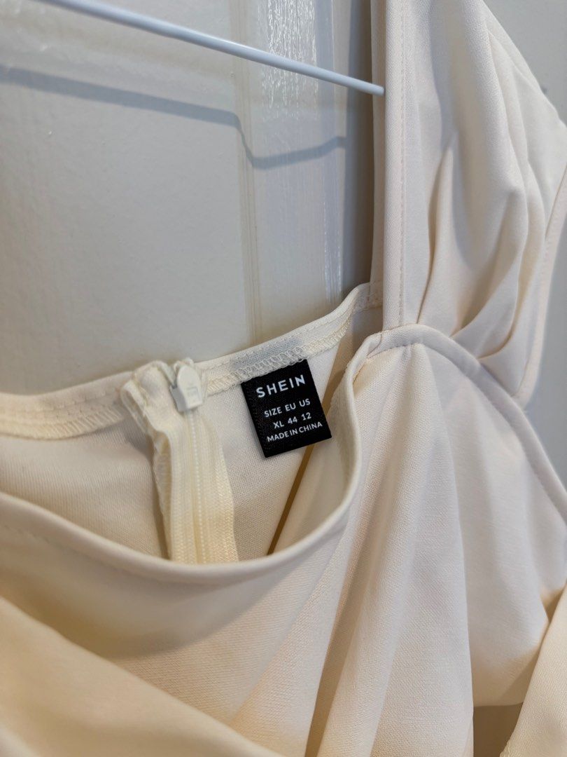 Shein Cream Midi Dress (Category: Dresses) located in Cavite. Submitted by cielinesid (Listing ID 1407313057, Image 3). Description: - Shein cream midi dress - Size: XL - Features: Crossover bodice, flowing skirt - Measurements: 39" bust, 33.9" waist - Condition: Never worn - Perfect for special occasions .