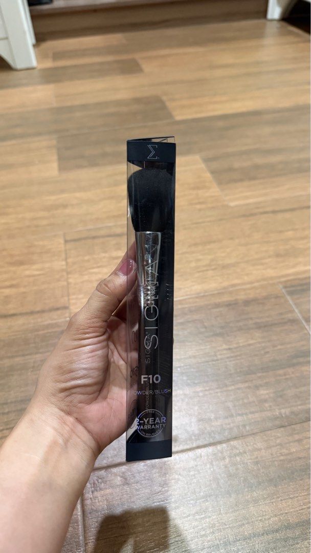 Sigma F10 Powder/Blush Brush (Category: Makeup) located in Paranaque City. Submitted by lovedstuffby_ang (Listing ID 1407319407, Image 3). Description: - Sigma F10 Powder/Blush Brush - Brand new, unopened - Original packaging included - Sleek black handle with Sigma logo - Silver ferrule - Black brush head - Comes with a 2-year warranty.