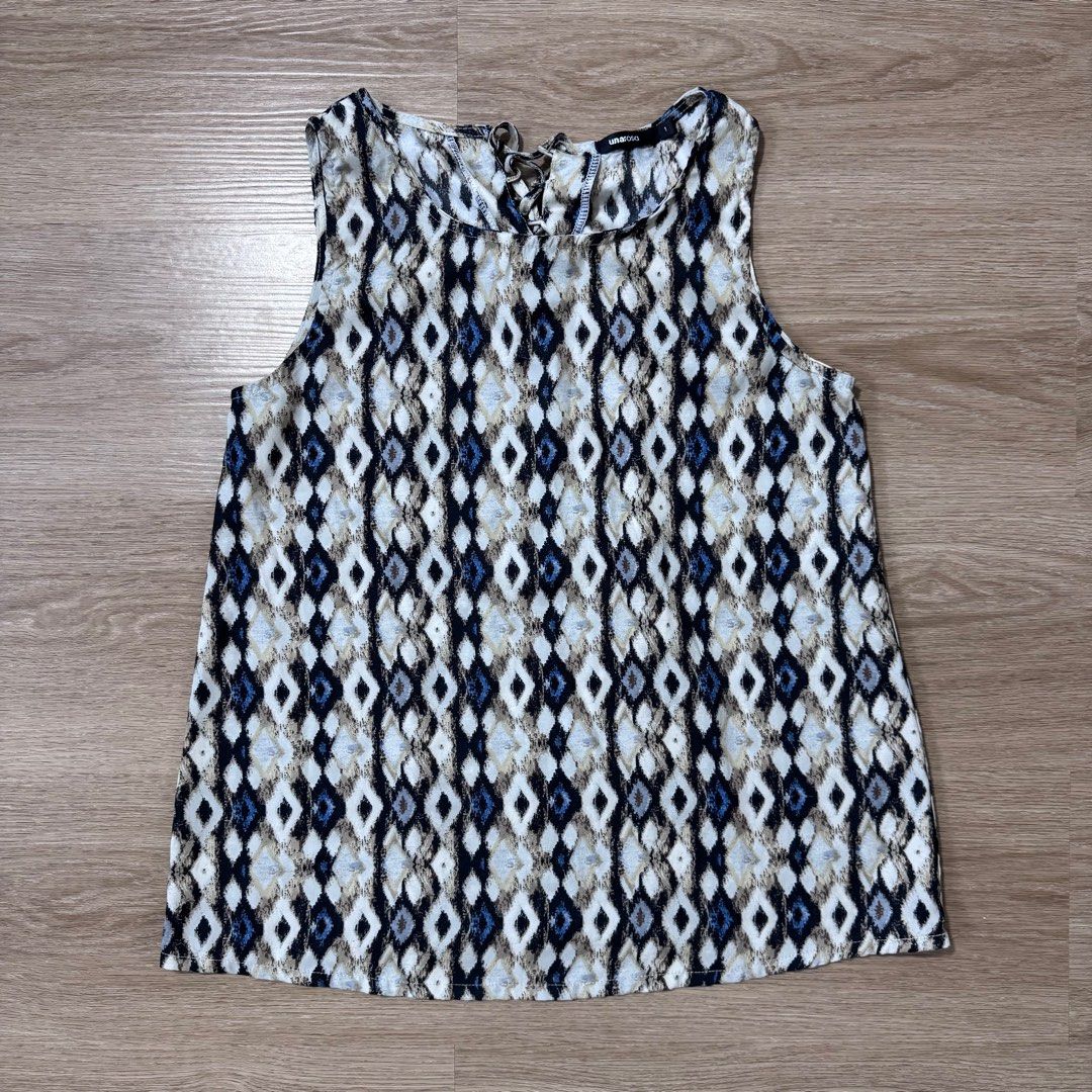 Una Rosa Geometric Print Sleeveless Top (Category: Sleeveless) located in Calamba. Submitted by happymom02 (Listing ID 1407217253, Image 1). Description: - Una Rosa sleeveless top - Unique geometric pattern - Round neckline - Tie-back detail - Size: Small - Lightweight fabric - Wash and wear - Ideal for warm weather - Colors: Blue, white, brown.