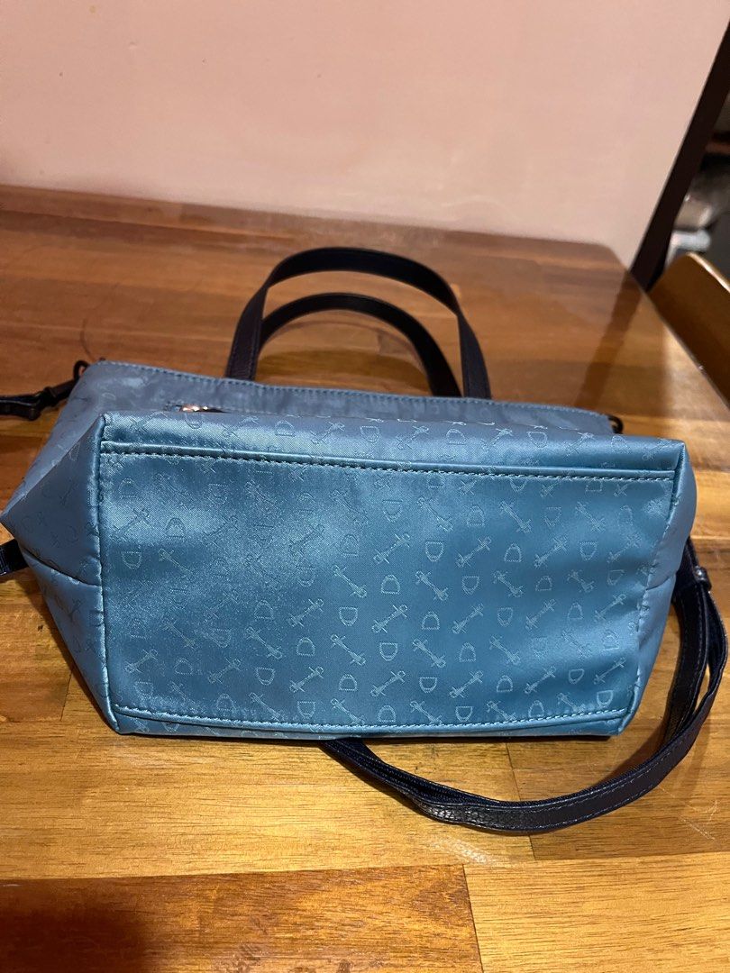WHY 2 way Nylon Goods Specialty Handbag (Category: Announcements) located in Angeles City. Submitted by phynes (Listing ID 1407344294, Image 3). Description: - Blue handbag with a repeating pattern - Top handle and detachable shoulder strap - Interior lined with brown fabric - Includes a zippered pocket - Brand: "WHY Goods Specialty" (leather patch inside) - Secure zipper closure - Good as new in excellent condition - Why branded from made in Ita