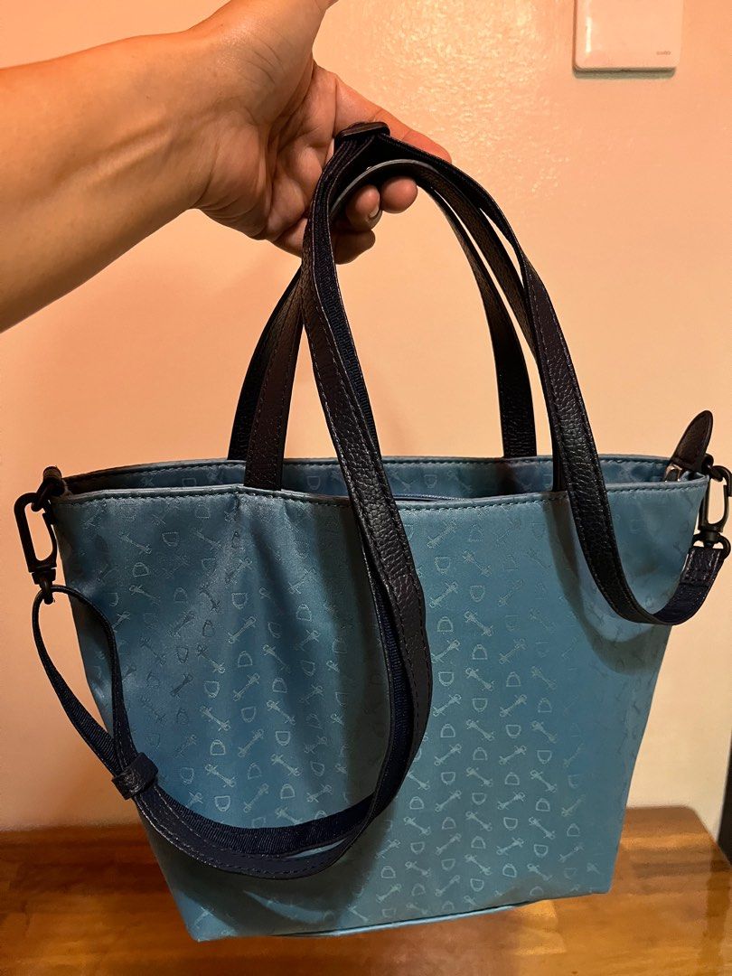 WHY 2 way Nylon Goods Specialty Handbag (Category: Announcements) located in Angeles City. Submitted by phynes (Listing ID 1407344294, Image 1). Description: - Blue handbag with a repeating pattern - Top handle and detachable shoulder strap - Interior lined with brown fabric - Includes a zippered pocket - Brand: "WHY Goods Specialty" (leather patch inside) - Secure zipper closure - Good as new in excellent condition - Why branded from made in Ita