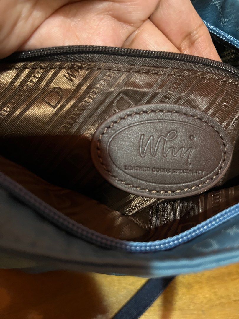 WHY 2 way Nylon Goods Specialty Handbag (Category: Announcements) located in Angeles City. Submitted by phynes (Listing ID 1407344294, Image 2). Description: - Blue handbag with a repeating pattern - Top handle and detachable shoulder strap - Interior lined with brown fabric - Includes a zippered pocket - Brand: "WHY Goods Specialty" (leather patch inside) - Secure zipper closure - Good as new in excellent condition - Why branded from made in Ita