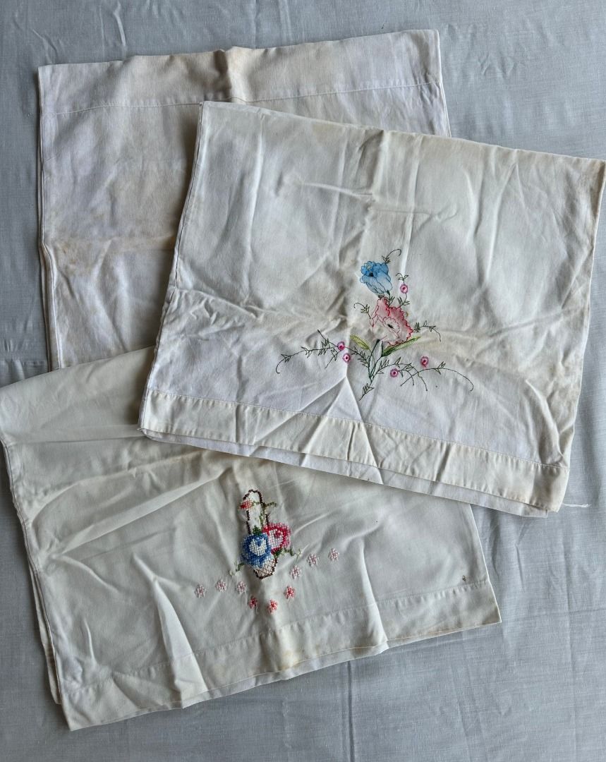 3PCS Vintage Embroidered Floral Cloth (Category: Luxury Apparel) located in Balanga. Submitted by manitidiana (Listing ID 1408929865, Image 1). Description: - Vintage cloth with delicate floral embroidery. - Design: Basket of flowers in blue, red, and green, with scattered pink flowers. - Fabric: Light, possibly sheer. - Shape: Rectangular..